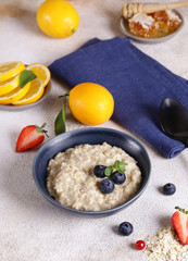 oatmeal with berries and honey for breakfast © Olga Kriger