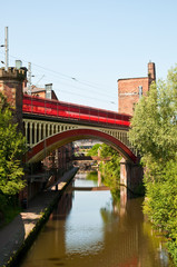 Railway bridge over Bridgewater canal, Castlefield, Manchester, UK