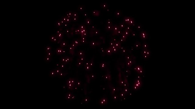 Animation of a single colorful red firework on a black 4k background