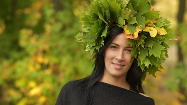 Woman in a wreath of leaves 
