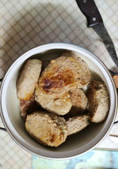 Fried meatballs in a pan on the kitchen table