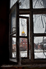 view of the Church through the old window
