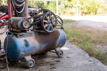 Old Piston Air Blue compressor used in the factory to recycle Industrial,Agro-industry of household Rural style in Thailand.