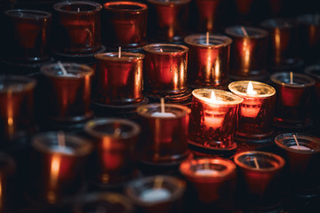 Two burning red candles in a church