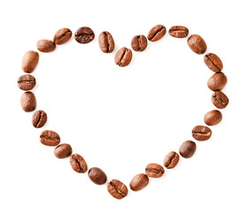 Coffee beans of the heart lie on a white, isolated. The view from the top
