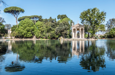 Villa Borghese pond with reflections on the water and fountains