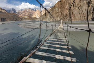 Hussaini suspension bridge passu cones mountain range rocky scenery huzza river gilt baltistan northern areas Pakistan