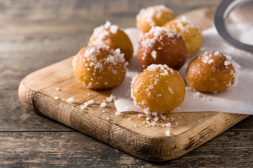 Carnival fritters or buñuelos de viento for holy week on wooden table	