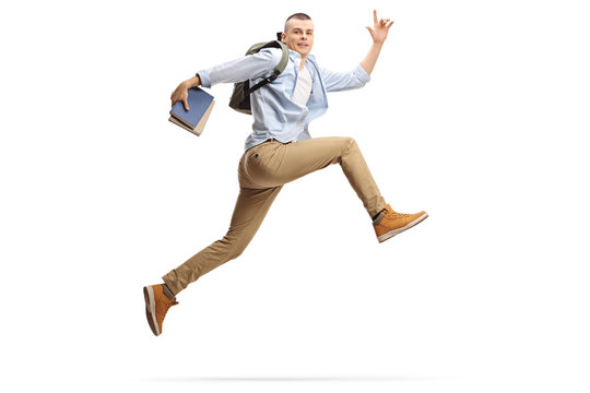 Tall Guy Holding Books And Jumping