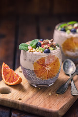 Chia seed pudding with fresh bananas,granola and bloody oranges