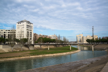 Fototapeta na wymiar Bridge over river Lez and new urban development, Montpellier, France