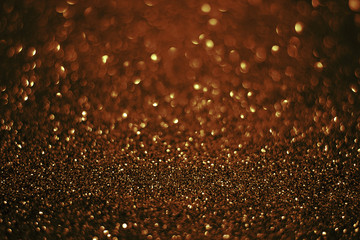 Fototapeta na wymiar red gold background with sparkling bokeh of texture abstract