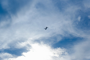 Fototapeta na wymiar silhouette of air plane on the sky