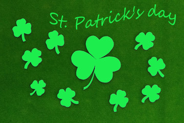 Clover leaves on a green background. St. Patrick's day. Leaves are an Irish holiday. March 17....