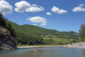 Fototapeta na wymiar Italy , Piacenza , Bobbio August 2019 , Berlina Bobbio beach is a fantastic place to relax in the fresh water of the river during the summer 