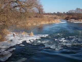 Winter river Protva in Russia. Sunny day and ice