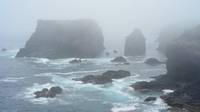 Sea stacks and cliffs in the mist at Eshaness / Esha Ness, peninsula in Northmavine on the island of Mainland, Shetland Islands, Scotland, UK