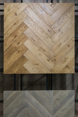 Obraz na płótnie Canvas Herringbone parquet texture in the store. Light-colored flooring probe