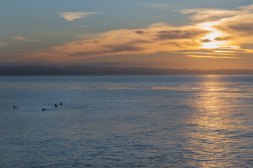 surfers at sunrise