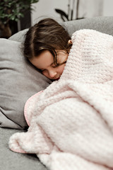 sleeping girl,sleeping little girl covered with a blanket,little girl sleeping in a chair,healthy sleep,beautiful girl covered with a blanket