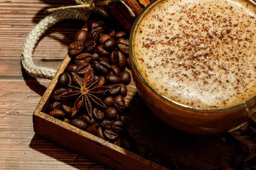 Cup of coffe Cappuccino  with milk on a dark background. Hot coffe ,latte or Cappuccino prepared with milk on a wooden table with copy space.