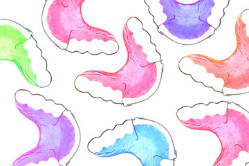dental braces or retainers for teeth on background, close up