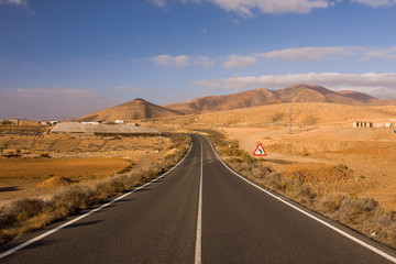 Fototapeta na wymiar Deserted country road, highlands of Fuerteventura, Canary Islands, Spain, Europe