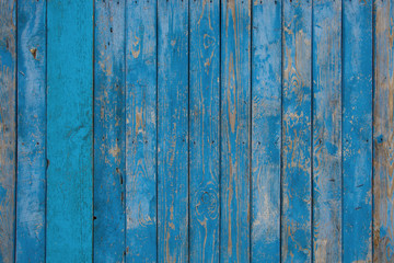 wooden old blue painted wall with scuffs