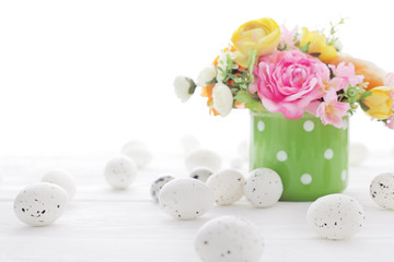 colorful easter eggs and spring flowers