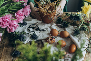 Easter decor is prepared on a wooden table
