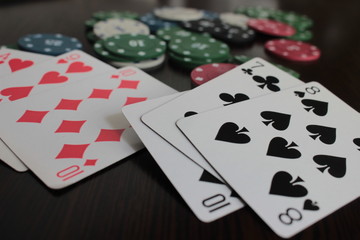 poker chips and cards on white background
