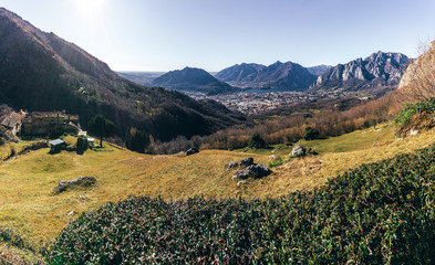 Nature and landscape during the late afternoon seen from the Lombard Mountains above the city of Lecco, Italy - February 2019.