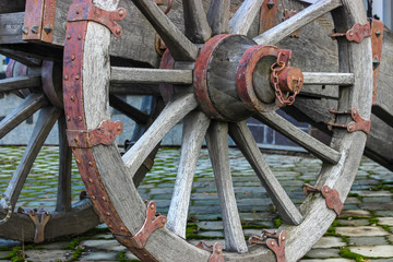 Wooden wheel of an old cannon with wrought iron elements