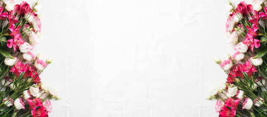 Springtime blossoming pink branch background flat lay