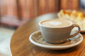 Coffee cup fresh cream organic cappuccino on table in cafe