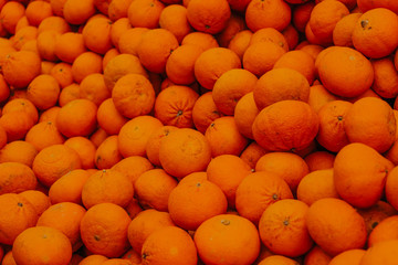 Lots of oranges or tangerines, sale of oranges, fruit market