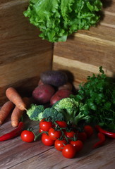 still life of fresh vegetables on a wooden background