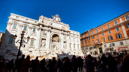 Fototapeta premium The marble facade of the Trevi Fountain illuminated by the sun