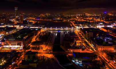 Yekaterinburg aerial panoramic view at night. Ekaterinburg is the fourth largest city in Russia and the centre of Sverdlovsk Oblast located in Eurasian continent on the border of Europe and Asia.