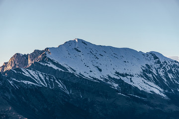 Nature and landscape during the late afternoon seen from the Lombard Mountains above the city of Lecco, Italy - February 2019.