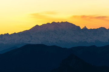 Monte Rosa, one of the highest peaks of the Alps, at sunset during a cloudless day, near the town of Lecco, Italy - February 2020.