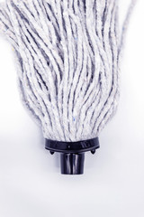 A rope MOP without a stick on a white background of a vertical photo. Floor cleaning MOP