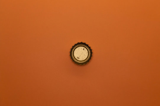 bottle cap on orange background
