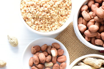 Dried peanuts (Arachis hypogaea) peanuts in shells, whole and chopped in containers