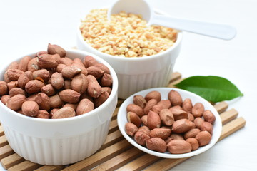 Dried peanuts (Arachis hypogaea) peanuts in shells, whole and chopped in containers