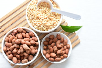 Dried peanuts (Arachis hypogaea) peanuts in shells, whole and chopped in containers