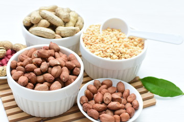 Dried peanuts (Arachis hypogaea) peanuts in shells, whole and chopped in containers