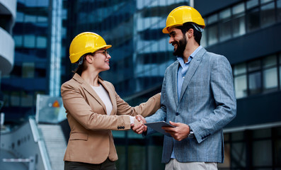 Construction engineers checking building site. Construction concept