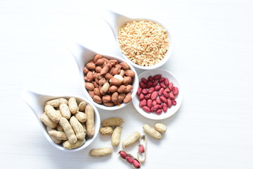 Dried peanuts (Arachis hypogaea) peanuts in shells, whole and chopped in containers