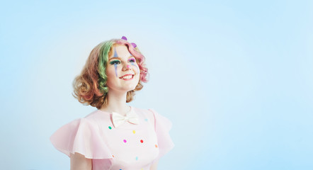 smile clown girl on blue background